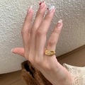 Golden butterfly enamel ring with rectangular face and star engraving on model finger - Star Square