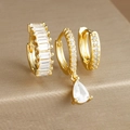 Detailed view of three gold drop earrings with zircon crystals and luxury polished finish - Three-Piece Set / Gold-White Zirconia