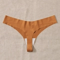Seamless ginger thong for women, high-elasticity sports underwear on beige fabric - Caramel color