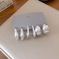 Detailed view of three pairs of silver-tone oval C-shape hoop earrings on a display card - 5# Silver Pin (6-Piece Set) / Silver
