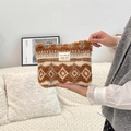 Detailed view of a plush winter cosmetic bag featuring brown geometric snowflake patterns - Diamond Brown Plaid