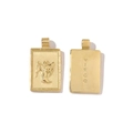 Close-up of golden rectangular Virgo zodiac pendant with detailed relief and engraving - Virgo