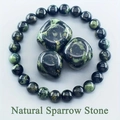 Detailed view of Natural Sparrow Stone beaded bracelet and polished raw stones - Sparrow Stone