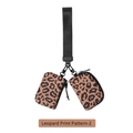 Detail of leopard print wristlet bag with dual zip pouches and black strap attachment - Leopard Print Pattern 2