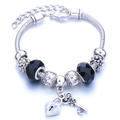 Silver snake chain bracelet with black faceted beads and heart lock key charms - Black
