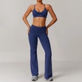 Women's dark blue fitness set with cross-strap sports bra and high-waisted flare yoga pants - S / Bra + Flare Pants / Navy Blue