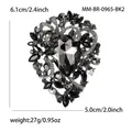 Vintage style gun-black brooch featuring a large black teardrop crystal and rhinestones - Gun Black