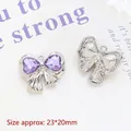Macro detail of silver bow pendants with purple heart gems and size measurement - 10# Large Bow Purple Heart Rhinestone