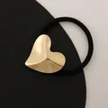 Minimalist elastic hair tie featuring a matte gold irregular heart alloy ornament - Embossed Hearts