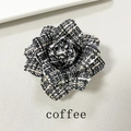 Detail of coffee brown tweed camellia brooch with a retro houndstooth pattern weave - Coffee Blend