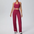 Detail of berry red halter yoga set featuring high-waist straight-leg pants and crop top - S / Top And Bottom / Carmine