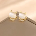 Golden cat-shaped stud earrings featuring cat eye stones and sparkling zircon bows - Double Kitten Set