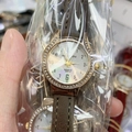 Detail of rose gold rhinestone watch with brown leather strap and white dial - Dark Gray