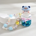 Quicksand bottle keychain featuring a cute penguin and blue liquid with colorful beads - Chain Style / Blue