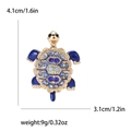 Detail view of rhinestone turtle brooch with size measurements 4.1cm by 3.1cm and 9g weight - Turtle Design (4473-BL) / Blue