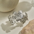 Silver stainless steel open bangle featuring layered five-petal floral design and matte finish - Silver Floral Cluster
