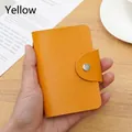 Handheld yellow RFID blocking card holder wallet with pebble grain leather and button - 24 Slots / RFID Yellow