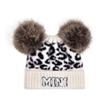 Close-up of baby leopard print knit hat with brown faux fur pom-poms and MINI embroidery - Leopard-MINI