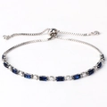 Detail of silver chain bracelet with blue rectangular gems and adjustable slide clasp - Royal Blue Zircon White Gold