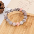 Detail of 8mm pink zebra jasper beaded bracelet with crystal spacers on a bamboo tray - 10mm Silver Rhinestone Spacer Style