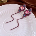 Detail of vintage Baroque earrings with pink gems and long tassels on white tray - Purple Flower Tassel Earrings (S925 Silver Needle)