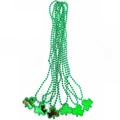 Multiple green plastic St. Patrick's Day necklaces with shamrock pendants on bead chains - Shamrock Pendant