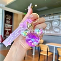 Detail of Mickey mouse shaped liquid quicksand keychain with purple sequins and bell - Purple Luminous Snowflake Mickey Head