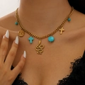 Dettaglio della collana placcata oro 18K con ciondoli a stella marina e turchese - Vintage Religioso Bohemien (09) / Oro