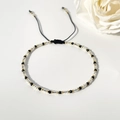 Bracciale di perline di vetro Miyuki con cordino nero regolabile e perline sfaccettate - Stile Perline di Spinello Nero / Nero/Oro