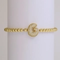 Elastic gold bead bracelet featuring a sparkling zircon-encrusted capital letter G charm - Letter G