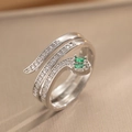 Vintage silver snake ring with green emerald eyes and rows of sparkling clear zircon stones - Silver