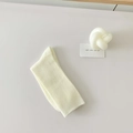 Off-white ribbed knit slouch socks in soft cotton fabric with vertical stripe texture - Cream