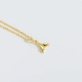 Elegant gold whale tail pendant necklace with a polished minimalist finish for women - Fish Tail
