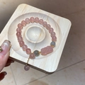 Macro view of strawberry quartz beads and a carved PiXiu charm on a beaded bracelet - 30# Bracelet (Exquisite Gift Box)