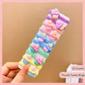 Close-up of 10-piece set of colorful cupcake charms on elastic nylon mini hair ties - Ice Cream (10 Pcs)