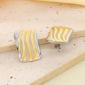 Macro detail of wave-patterned rectangular earrings in two-tone gold and silver finish - Rectangular Wave Line Style (KE118749-SP)