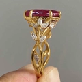 Detail of luxury vine ring with oval red gemstone and white marquise zircon accents - US 7 / Red