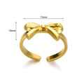 Detail view of golden bow ring with 15mm width and 10mm height dimensions on white background - 3D Sweet Bowknot Style (JZ6361) / Gold