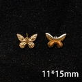 Detail view of 11x15mm golden butterfly charms with embossed texture and sleek silhouette - 11*15mm Butterfly Relief and Silhouette Pendant