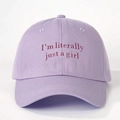Close-up of I'm literally just a girl embroidery on a lavender cotton baseball cap - Light Purple