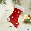 Red metal Christmas stocking ornament with white stars and hanging rope for festive decor - Red Sock
