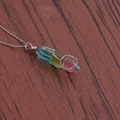 Close-up of rainbow crystal pendant with silver wire wrap on wooden background - A-NSN0234 Platinum Copper O-Chain