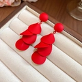 Close-up of matte red layered petal drop earrings displayed in a velvet jewelry box - 122# Radial Layered Petal Style (HE29310) / Red