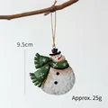 Christmas snowman metal ornament with green scarf and vintage finish on wood branch - Snowman with Green Scarf