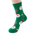 Detail of green Christmas crew socks with Santa Claus and gift patterns on a foot model - Size 35-40 / Santa Claus / Green