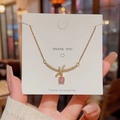 Ketting met strik-hanger, roze kristal en pavé diamanten in gouden afwerking - Strikje Roze Zirkonia Stijl / Goud