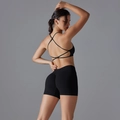 Detail of cross-back sports bra and high-waist fitness shorts in seamless black fabric - S / Black