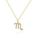 Detailed macro view of gold Scorpio zodiac pendant with sparkling zircon stones - Scorpio