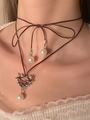 Detail of dark heart thorn pendant with hanging pearls on adjustable brown ribbon choker - Brown Ribbon Lace-up Barbed Heart Choker (N-235)