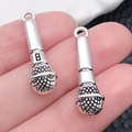 Set of two silver microphone pendants in vintage alloy style for DIY jewelry - Microphone (8x25mm-2.1g)
